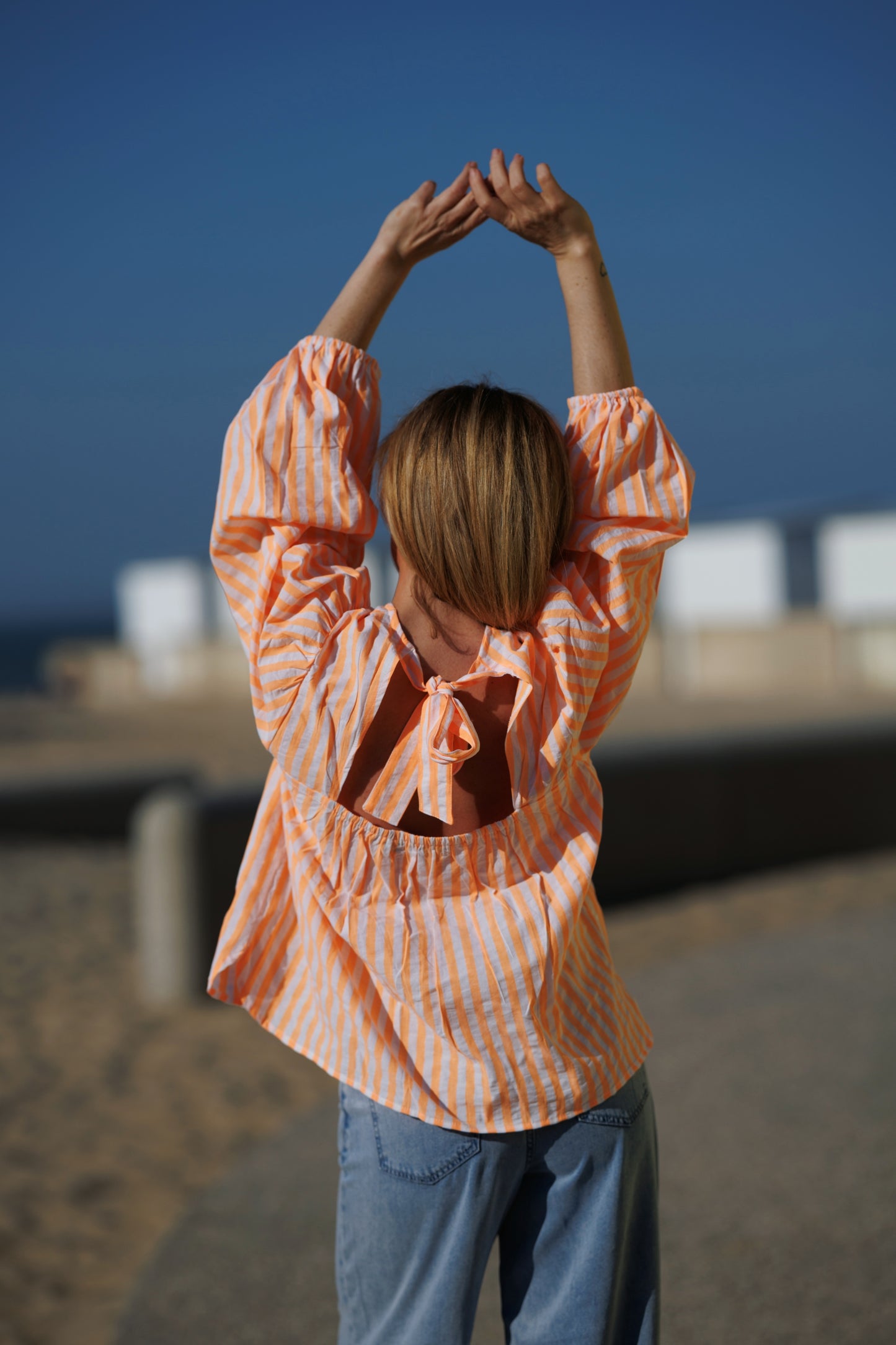 Blouse striped met strik oranje